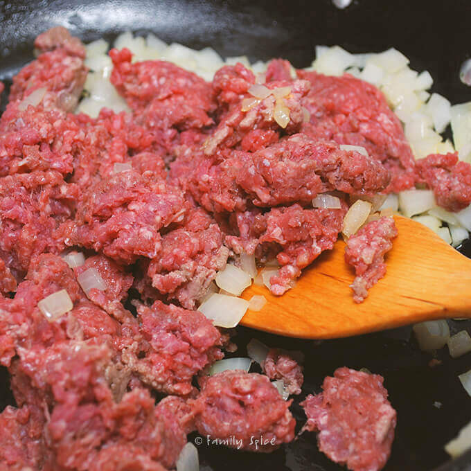 Browning meat and onions for Persian Stuffed Grape Leaves: Beef and Pomegranate Dolmeh by FamilySpice.com