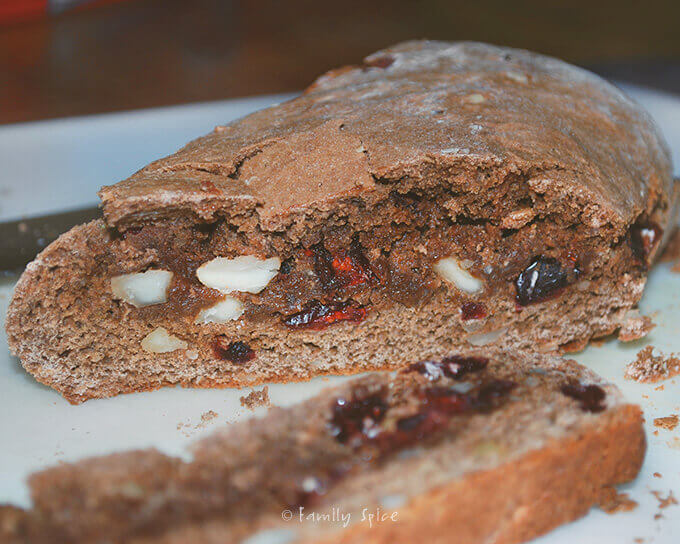 Slicing up Chocolate Biscotti with Cranberries and Macadamia Nuts by FamilySpice.com