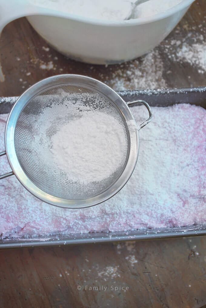Dusting Pink Pomegranate Marshmallows with Powdered Sugar by FamilySpice.com