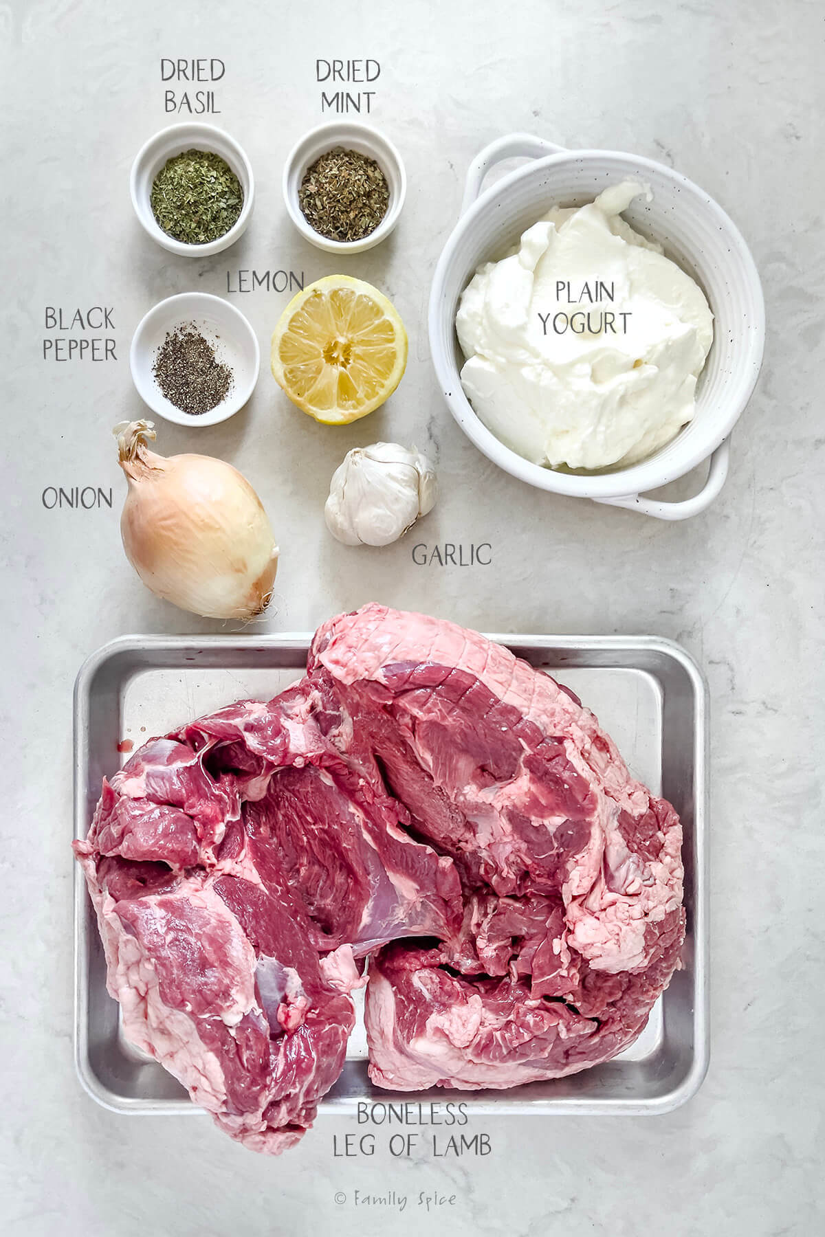 Ingredients labeled and needed to make yogurt marinated boneless leg of lamb