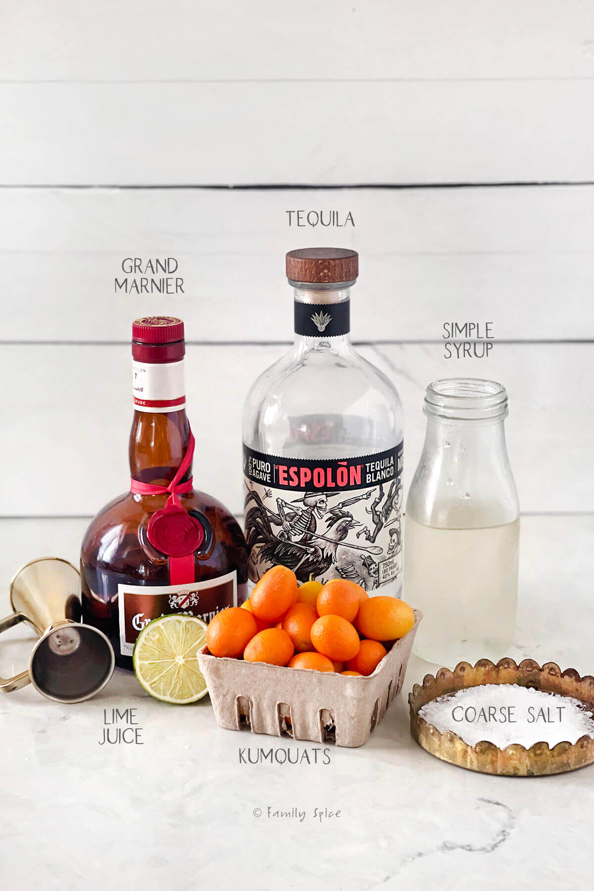 Ingredients labeled and needed to make kumquat margaritas.