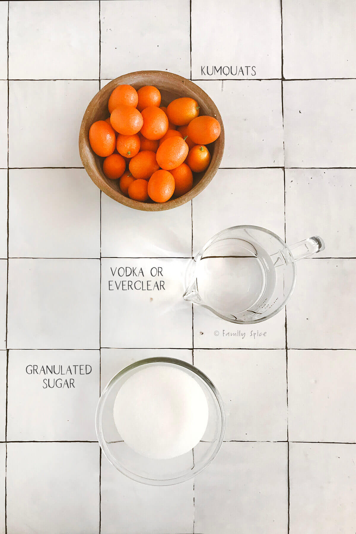 Ingredients labeled and needed to make kumquat liqueur.