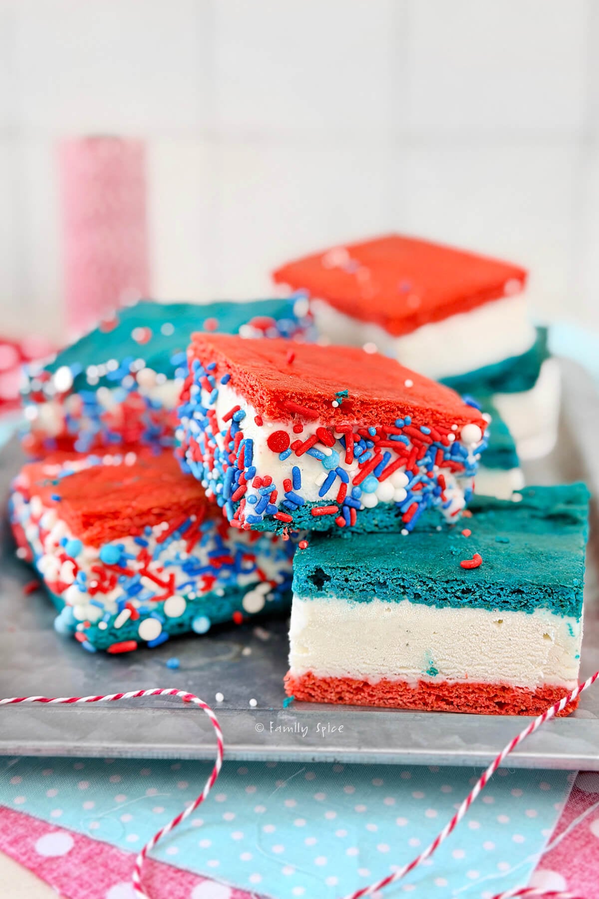 Close up of a tray with red, white and blue ice cream sandwiches using a box mix hack.