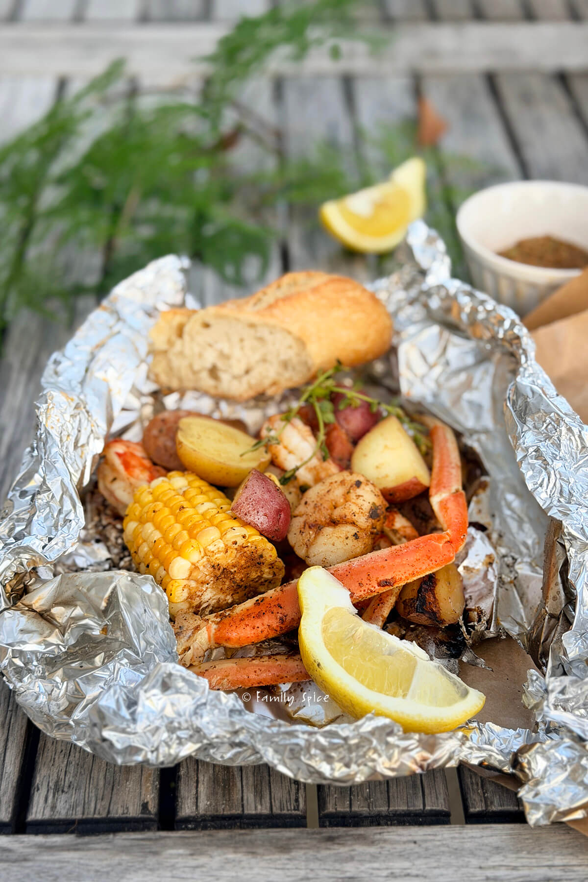 A seafood boil dinner cooked into a foil packet.