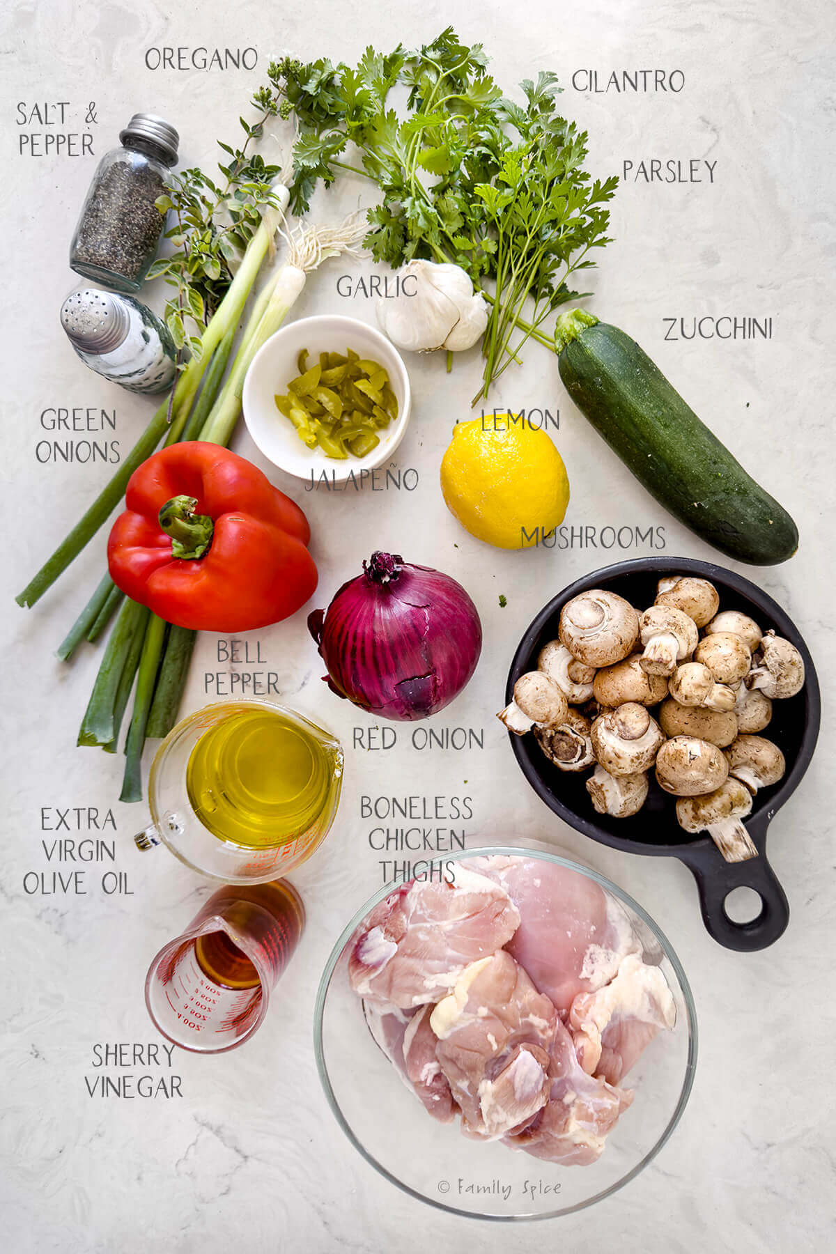 Ingredients labeled and needed to make chicken chimichurri with vegetables.