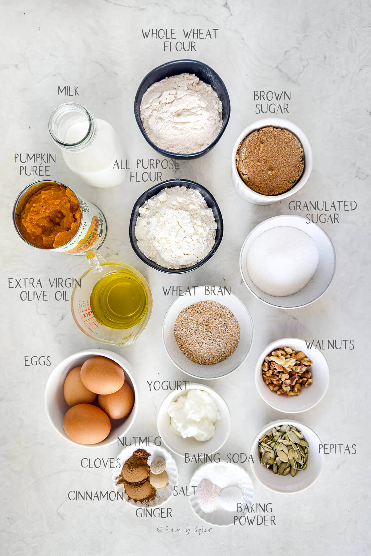 Ingredients labeled and needed to make olive oil pumpkin bread.