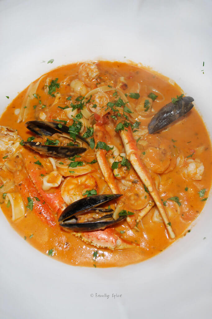 Top view of a big white bowl with Brazillian seafood stew in it
