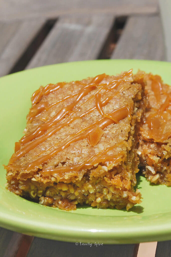 Two oatmeal butterscotch bars on a green plate