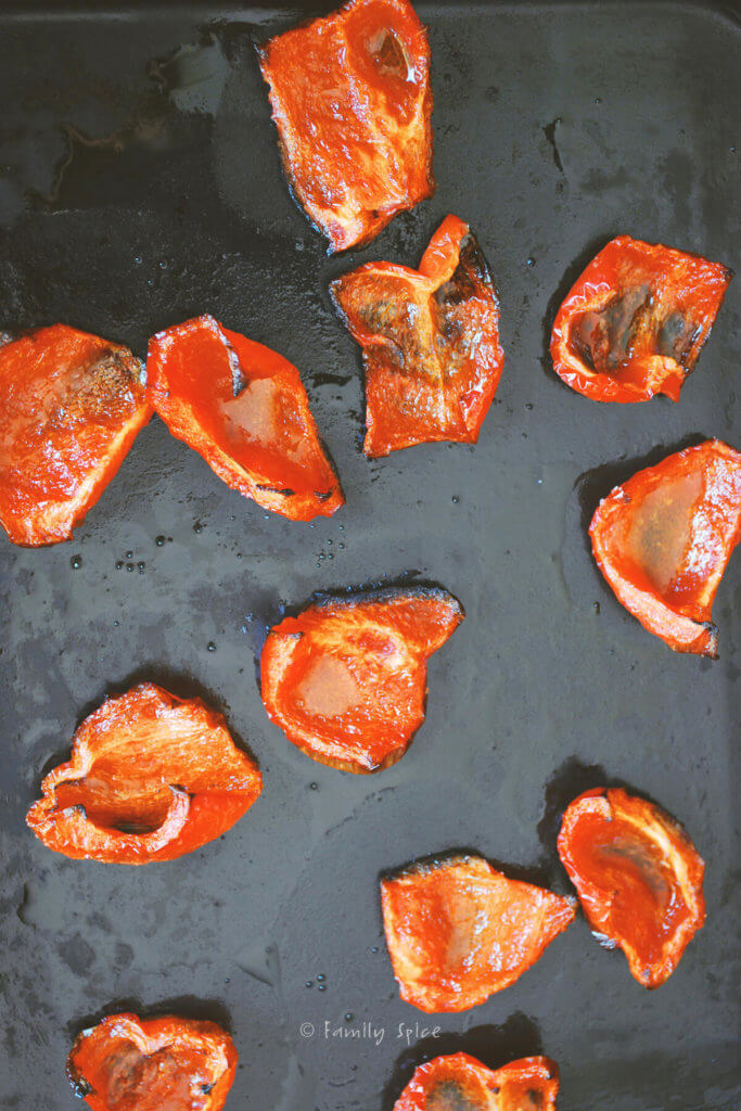 Roasted red pepper chunks on a baking sheet