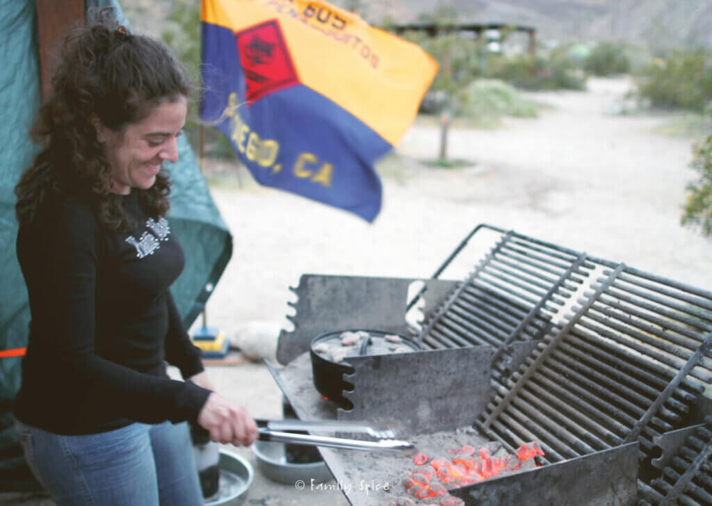 Laura Bashar cooking at a campsite