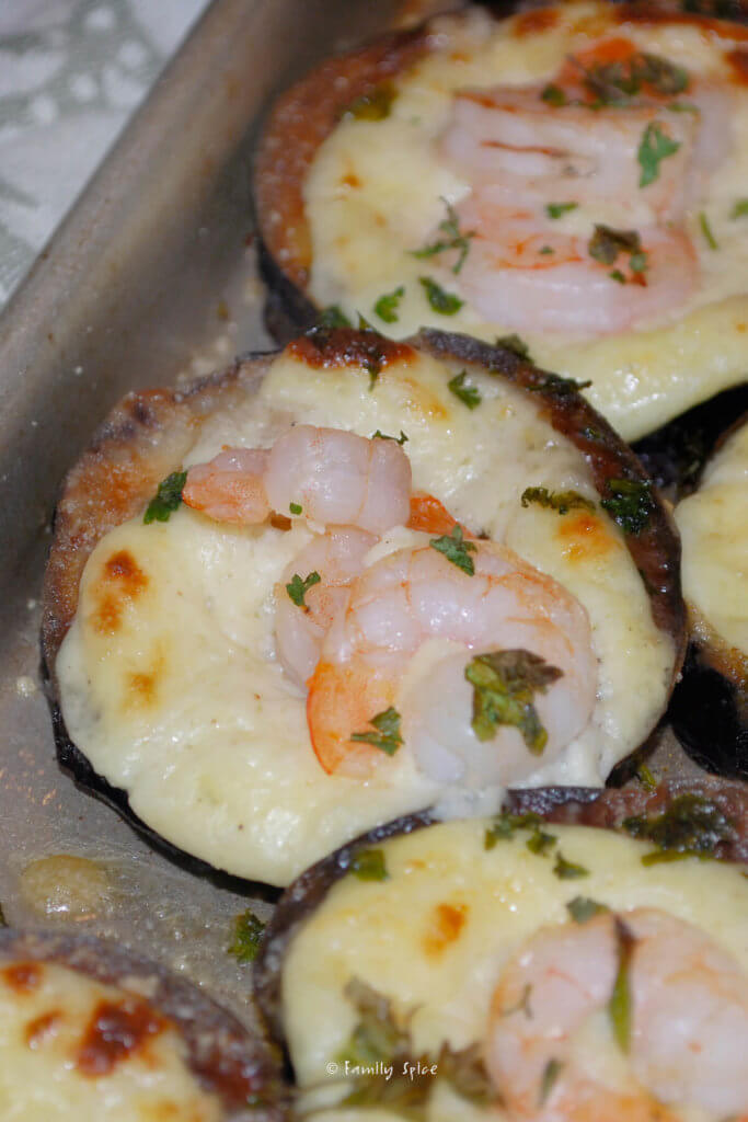 A round of eggplant fried and baked with manchego cheese and shrimp