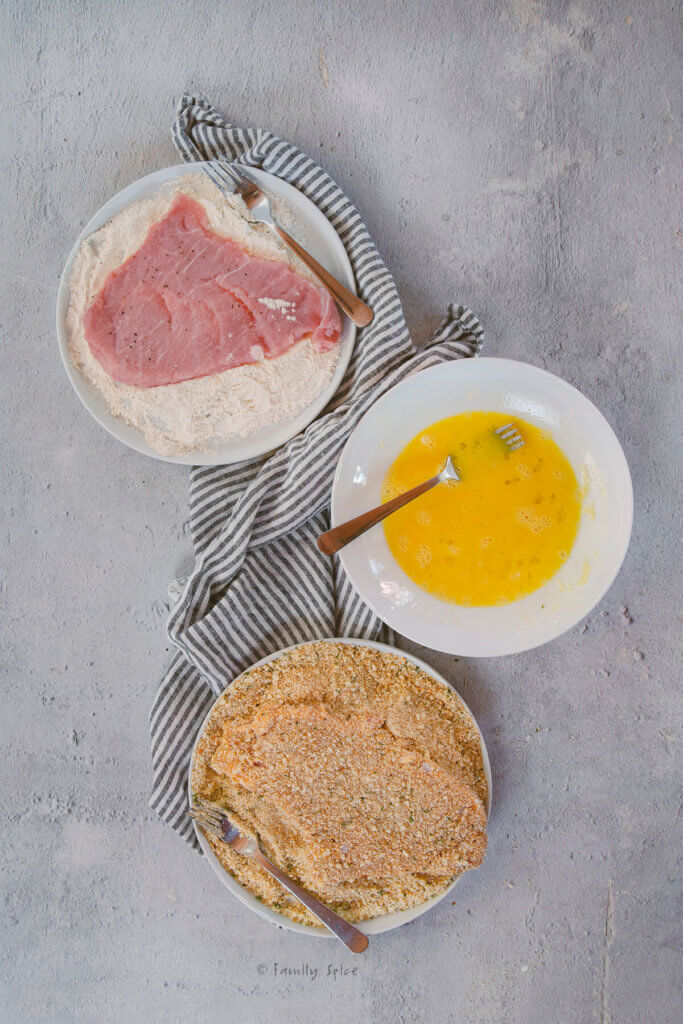 Coating pork cutlets in flour, egg and bread crumbs
