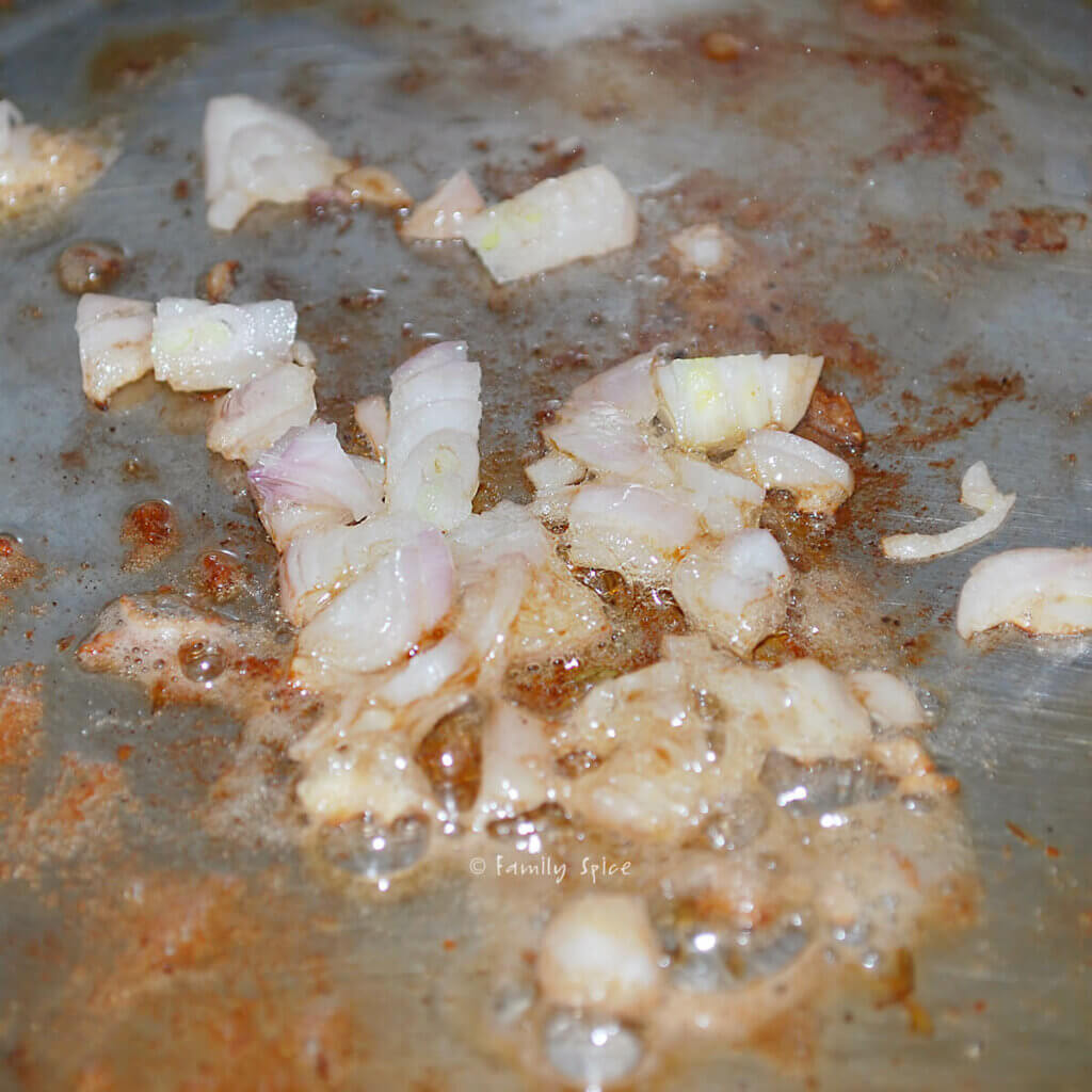 Browning chopped onions in a stainless pan