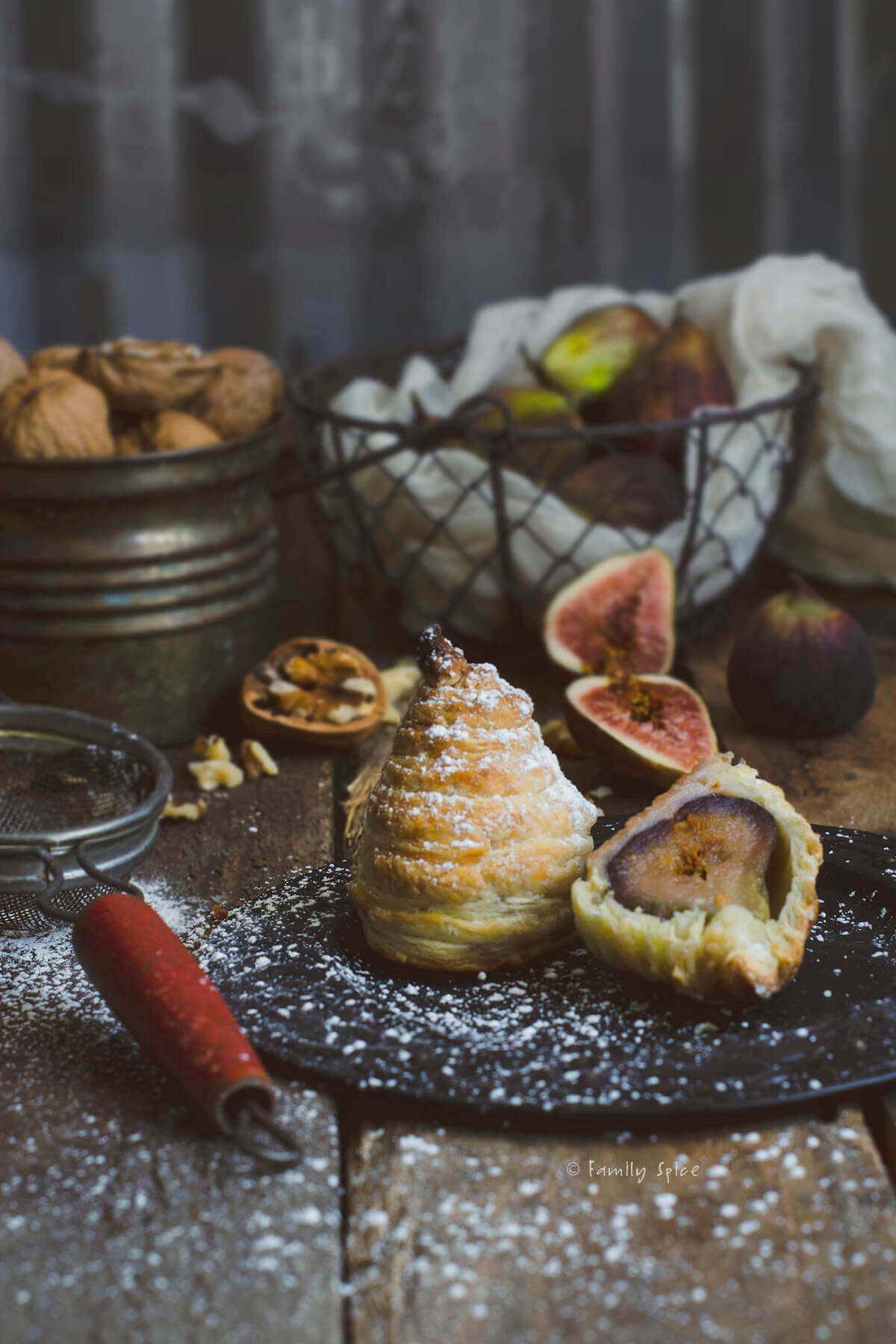 Figs baked in puff pastry and dusted with powdered sugar