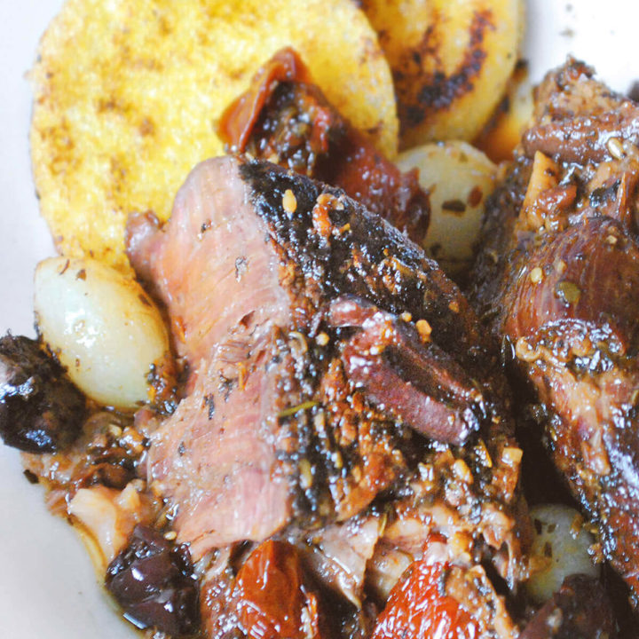 Italian pot roast with sun dried tomato and olives with browned polenta rounds