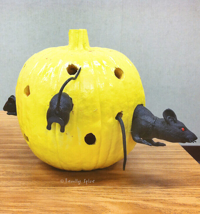 A Swiss cheese pumpkin with mice crawling through it by Familyspice.com