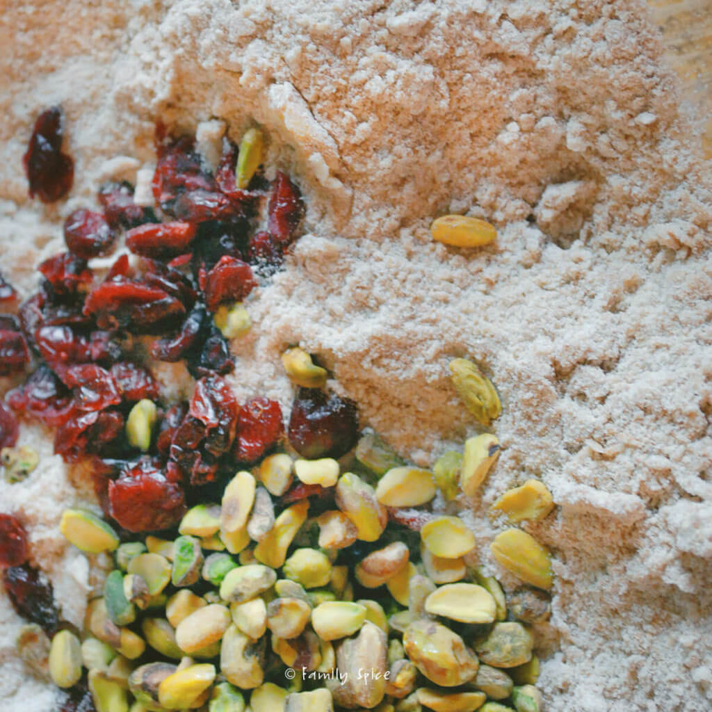 Dried cranberries, chopped pistachios added to whole flour to make wholemeal scones