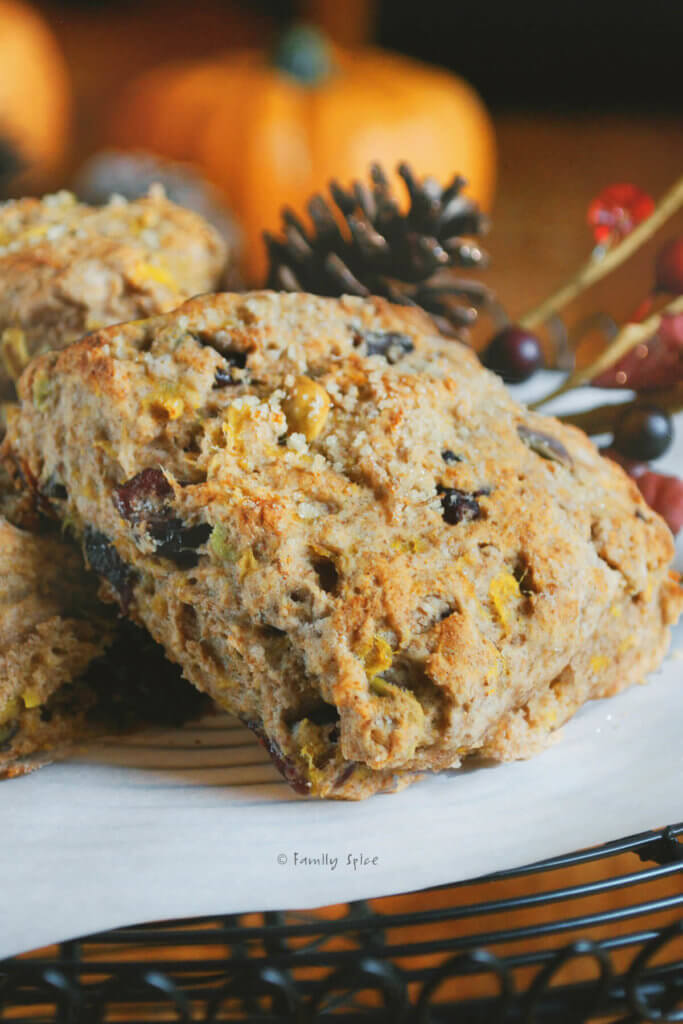 Wholemeal scones with pumpkin, cranberries and pistachios on a black wire cake stand