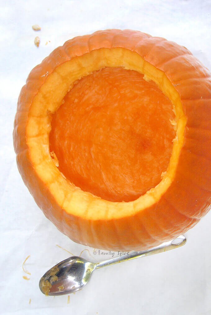 A cleaned out cavity inside an open pumpkin by FamilySpice.com