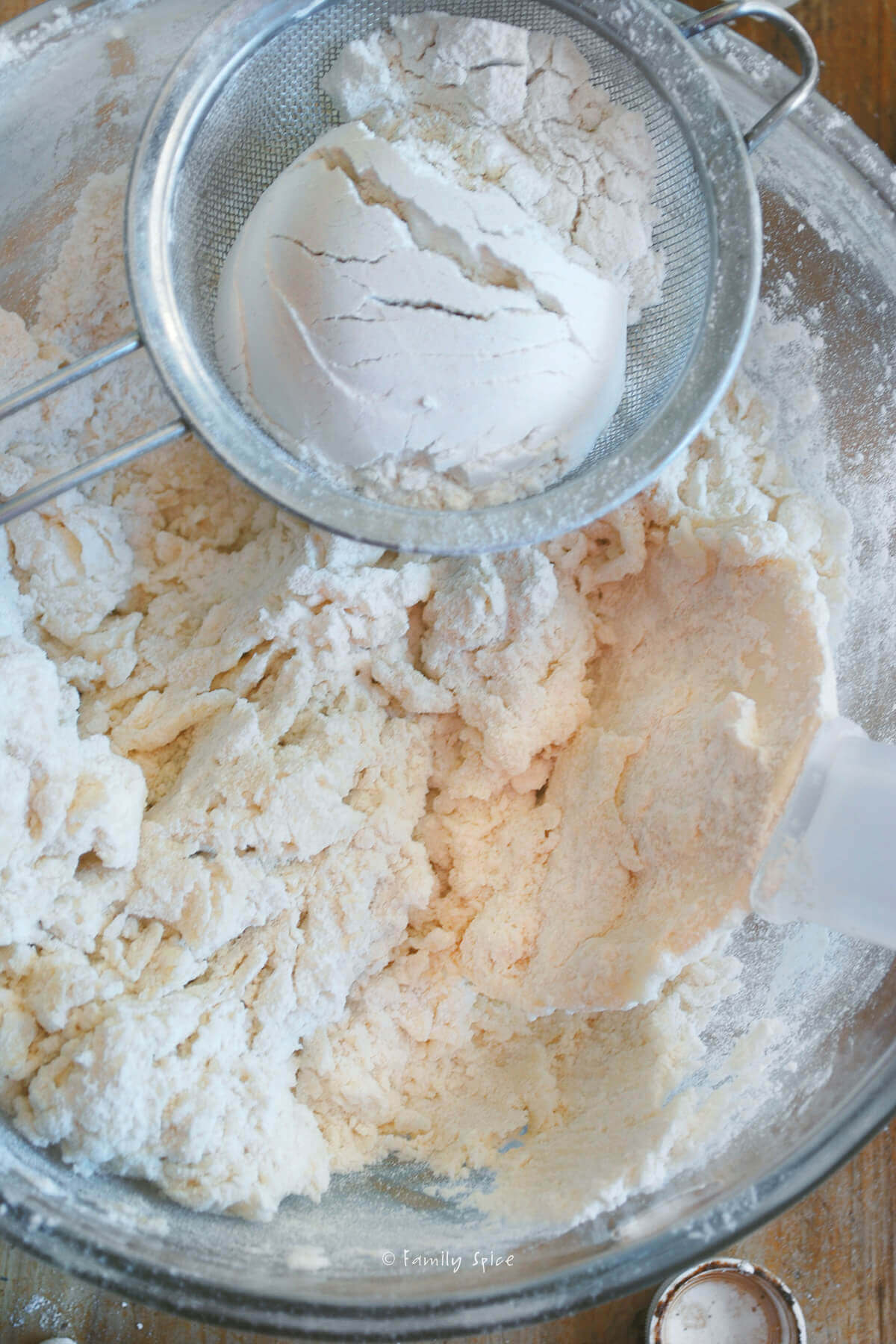 Adding flour to orange cookie dough