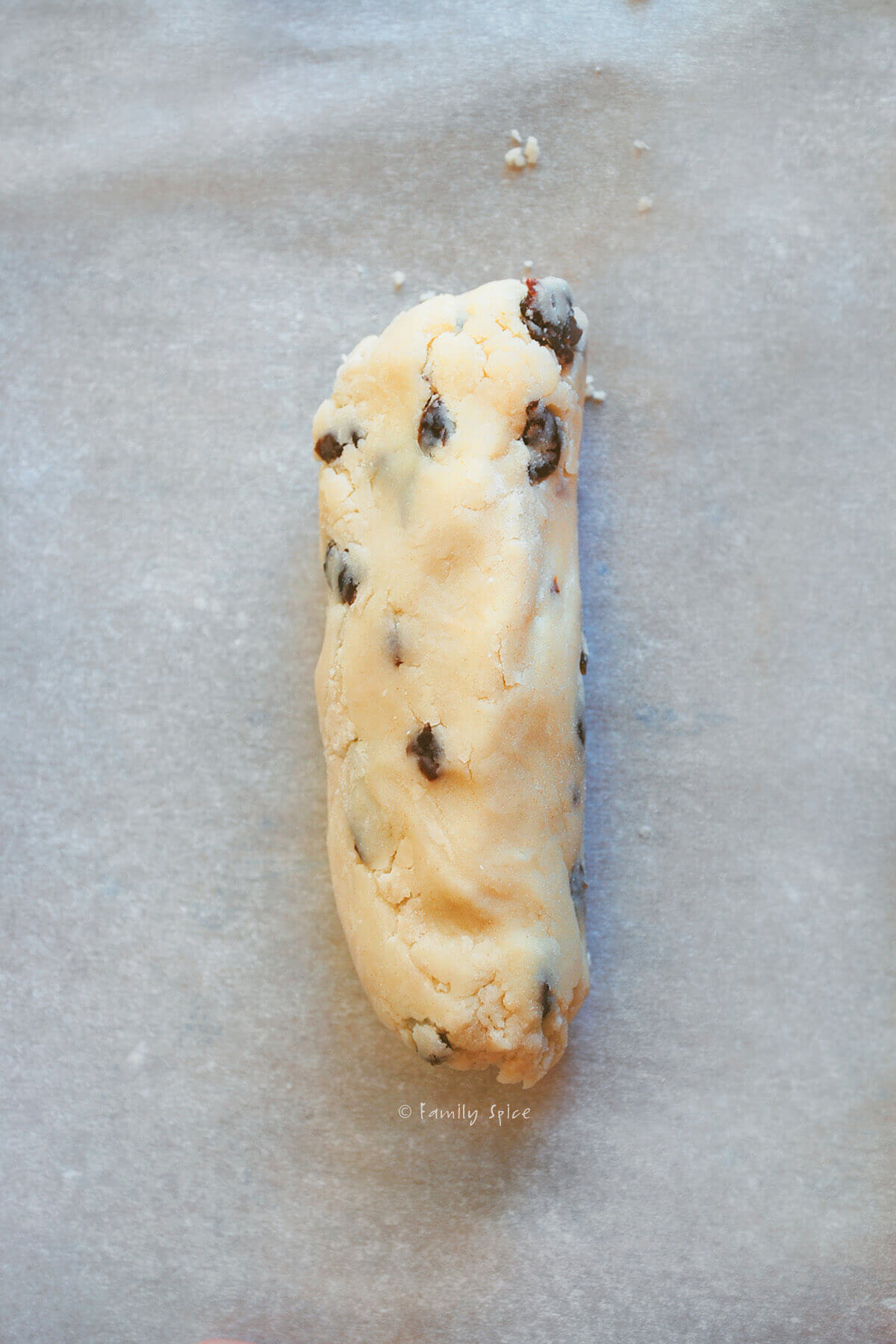 Cherry orange cookie dough rolled into a log and refrigerated