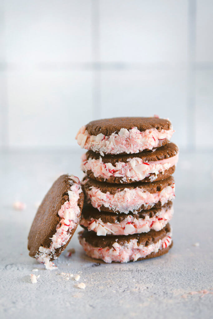 A stack of chocolate sandwich cookies stuffed with peppermint frosting and crushed peppermints