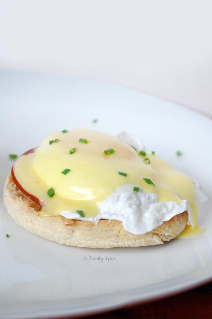 Close up of on egg benedict with hollandaise sauce
