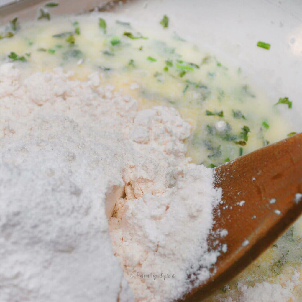 Closeup of ingredients to make herb dumpling batter in a bowl