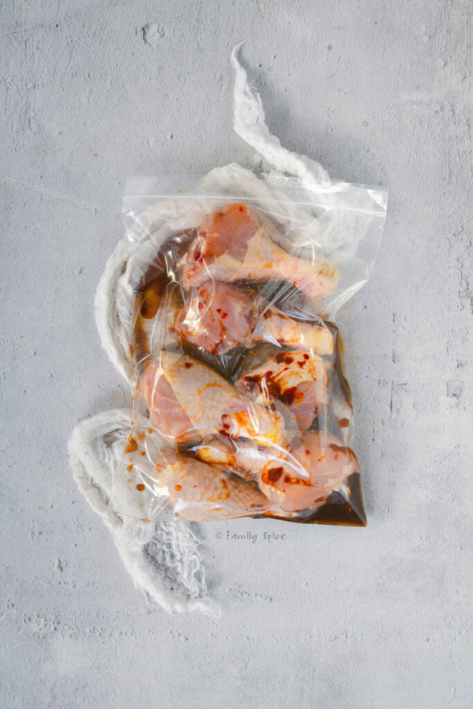 Marinated chicken legs in a resealable bag