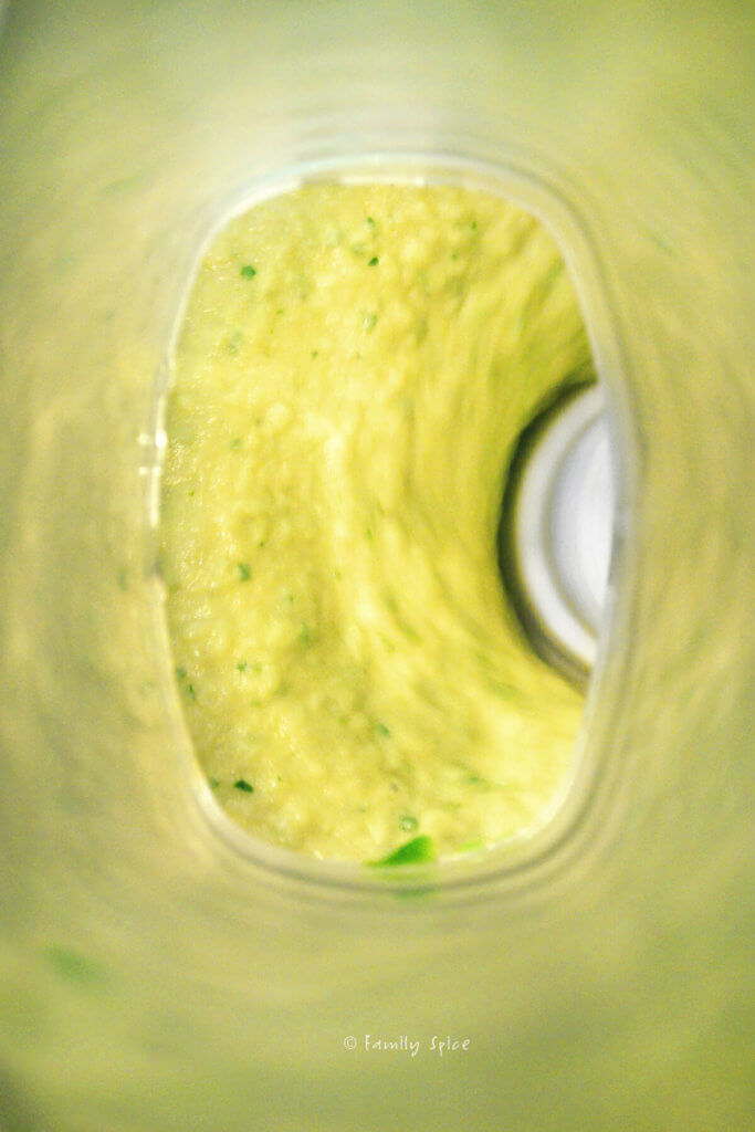 Puréed avocado hummus in a food processor