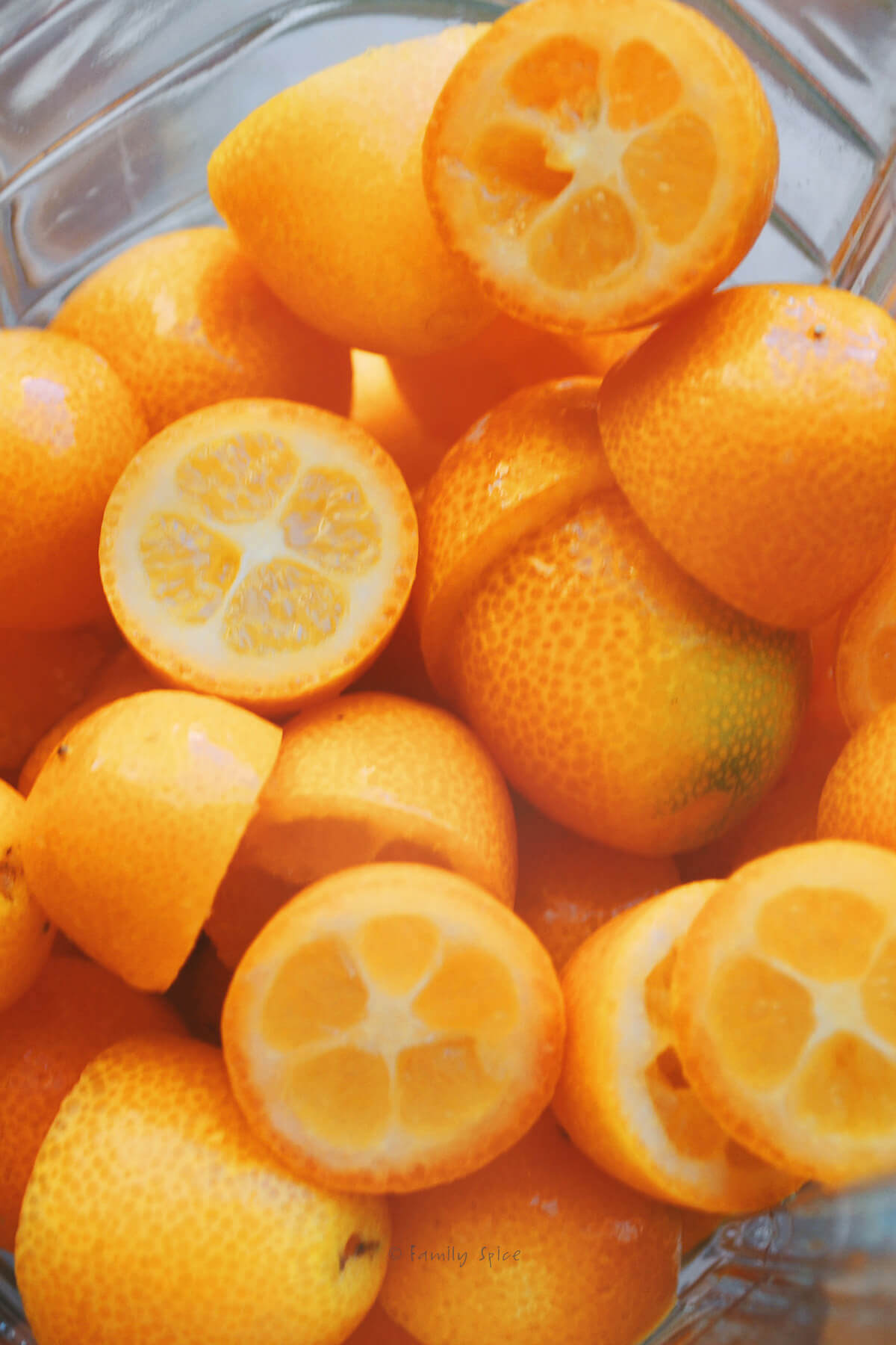 Closeup of halved kumquats in a blender