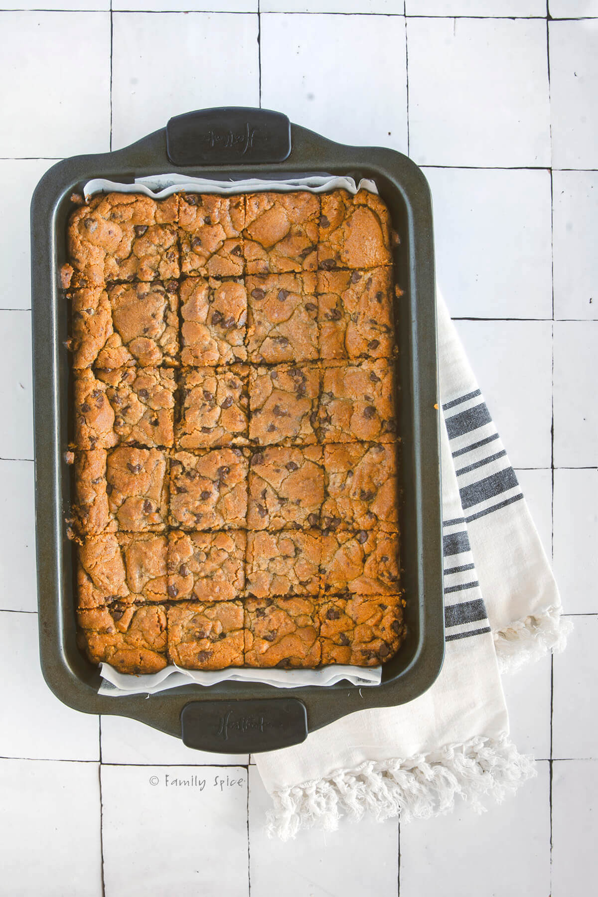 Freshly baked brookies in a baking pan cut into squares