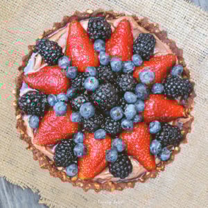 Top view of a Nutella pie with a variety of berries on top