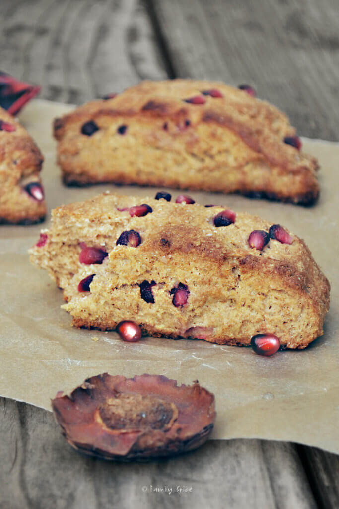 Whole wheat pomegranate scones on a wood table