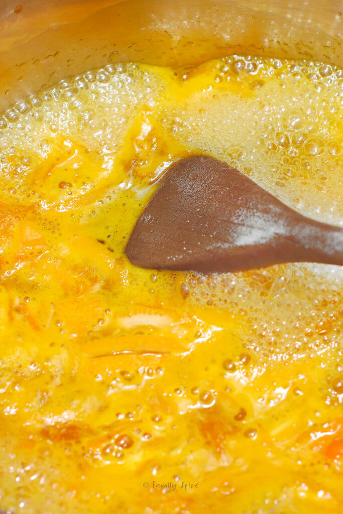 Making orange jam in a stainless pot