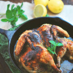This Spatchcocked Chicken with Mint and Garlic is marinated with mint, lemon zest and garlic and roasted in a cast iron pan for a quick and easy meal for any day of the week. -- FamilySpice.com
