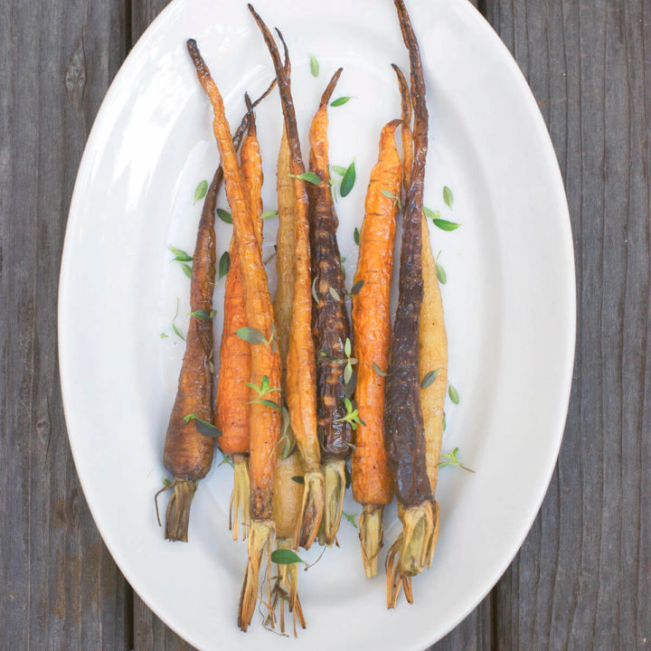 Overhead shot of a platter with roasted baby carrots