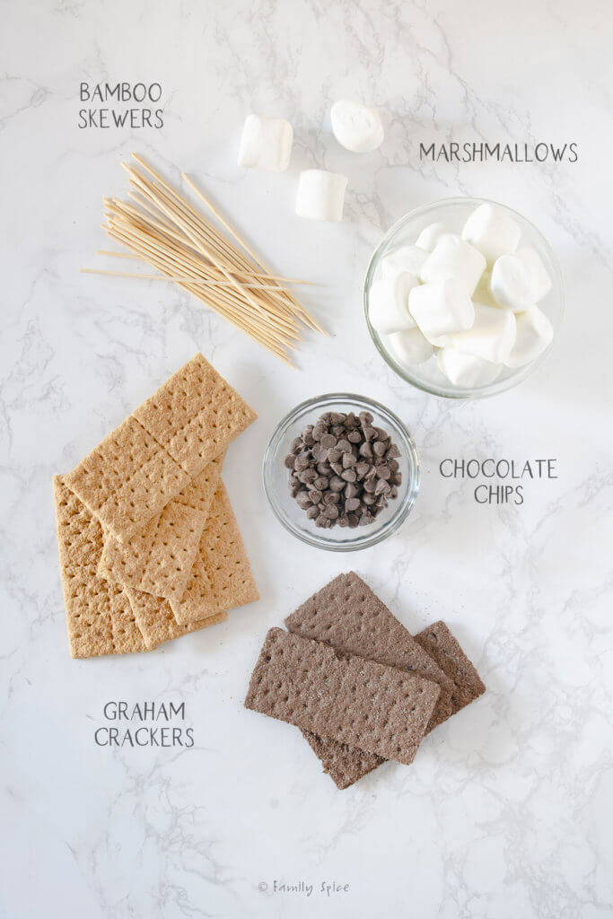 Ingredients labeled and needed to make smores on a stick (smore pops)
