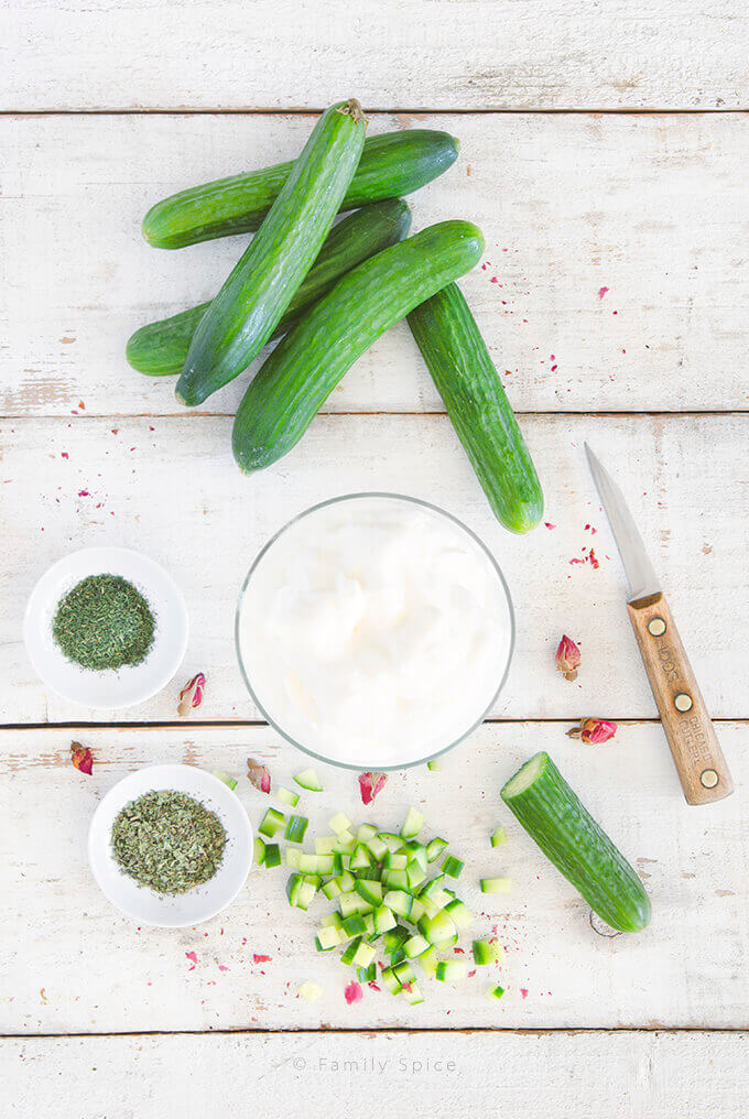 Overhead shot of ingredients need to make Persian Yogurt with Cucumber (Mast-o Khiar) by FamilySpice.com