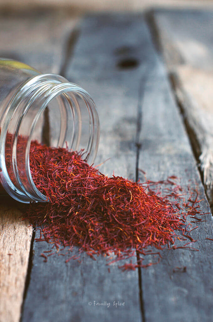 small jar of spilled saffron threads by FamilySpice.com