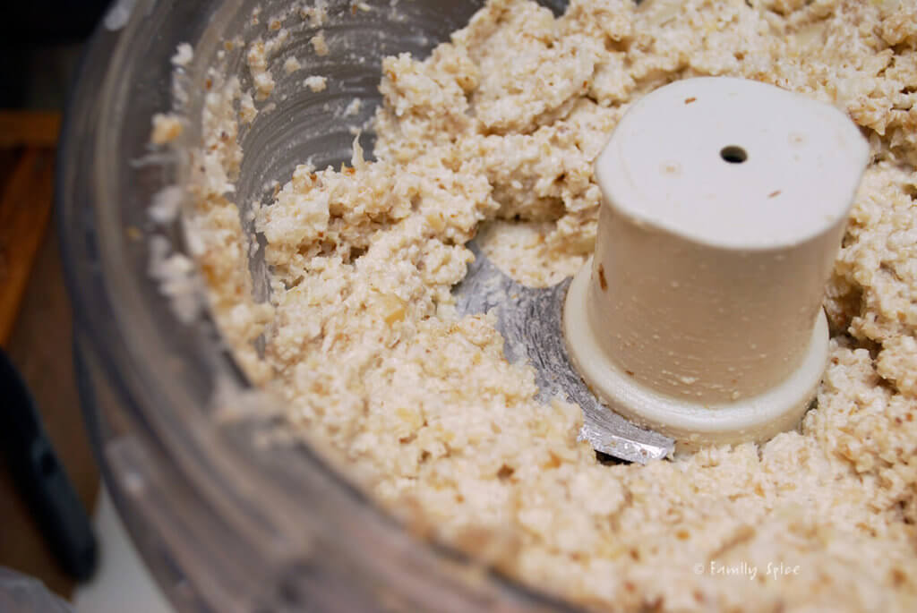 Puréeing walnuts and onions in a food processor