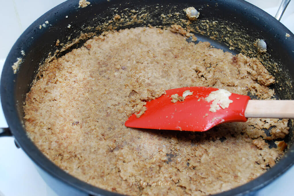 Browning walnut onion mixture in pan to make fesenjan