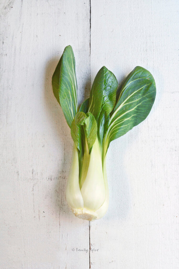 A bok choy on a white wood table