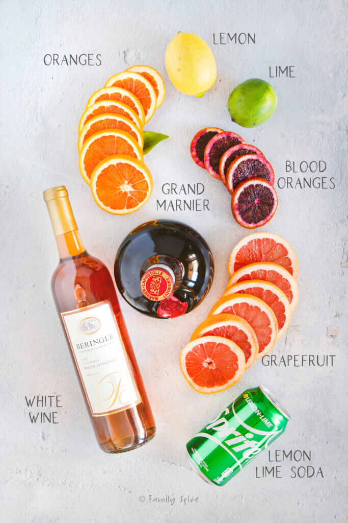 Ingredients labeled and needed to make citrus white sangria