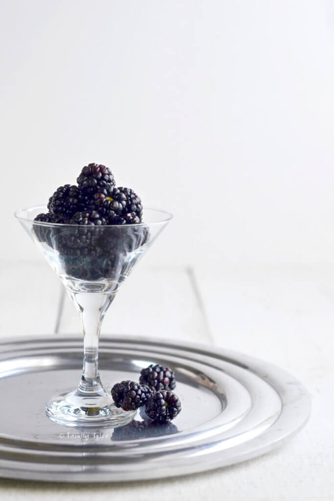 Fresh blackberries in a small martini glass