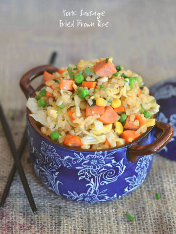 Closeup of fried brown rice with carrots, corn, peas and sausage by FamilySpice.com