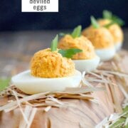 Pinterest image for pumpkin deviled eggs.