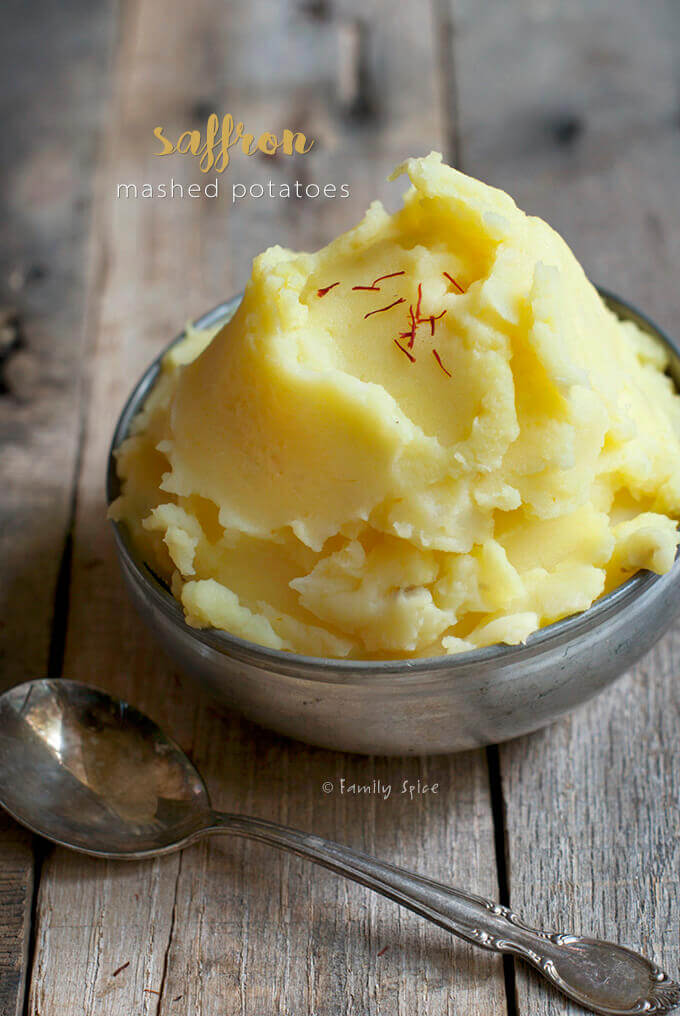 Overhead view of a bowl of Saffron Mashed Potatoes in a metal bowl by FamilySpice.com