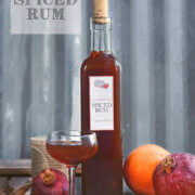 A bottle of pomegranate spiced rum with oranges by FamilySpice.com