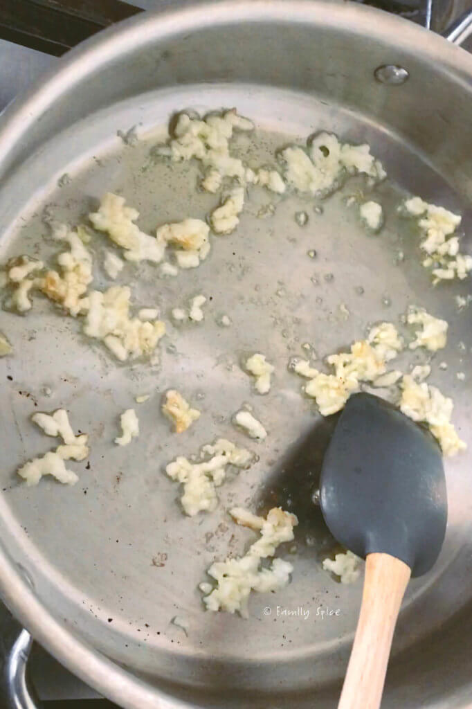Sautéing garlic in a stainless steel pan